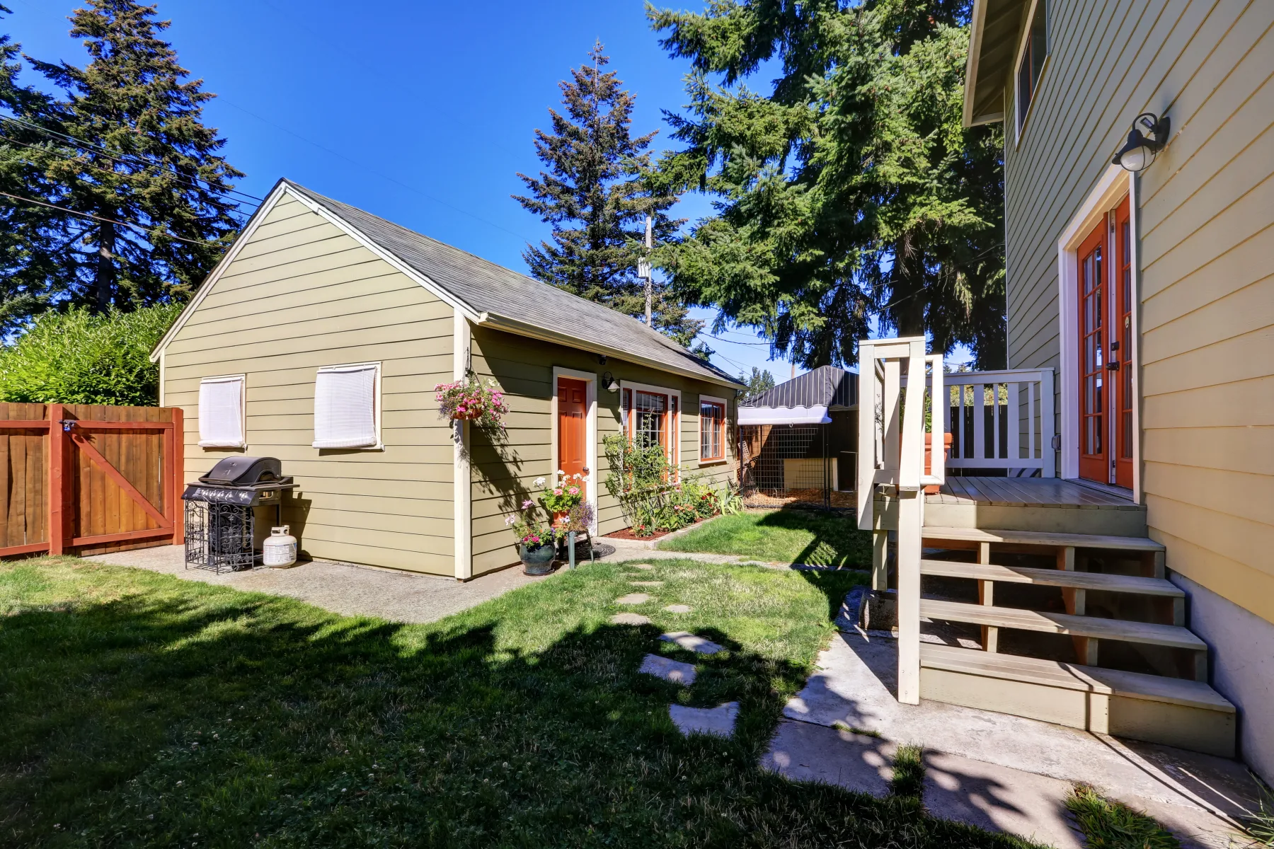 Finished backyard ADU with a covered porch